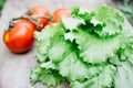 fresh vegetables, tomatoes, cucumbers, lettuce on a wooden table Royalty Free Stock Photo