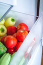 Fresh vegetables, tomatoes, peppers, cucumbers, broccoli, squash, zucchini in the refrigerator drawer for vegetables Royalty Free Stock Photo