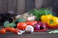 Fresh vegetables: tomatos, cucumbers, peppers, onions, garlic and green seasonings Royalty Free Stock Photo