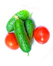 Fresh vegetables. two tomatoes and three cucumbers prepared to make salad Royalty Free Stock Photo