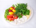 Fresh vegetables and various cheeses. Royalty Free Stock Photo