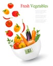 Fresh vegetables with in a weight scale. Diet concept.