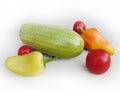 Fresh vegetables on a white background. Zucchini, peppers and tomatoes