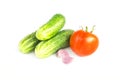 Fresh vegetables. Whole green cucumbers, red tomatoes, garlic. Salad ingredients, harvest isolated on white background Royalty Free Stock Photo