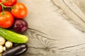 Fresh vegetables on wooden background. The icon for healthy eating, diets, weight loss.