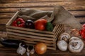 Fresh vegetables in wooden box on wooden background Royalty Free Stock Photo
