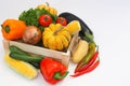 Fresh vegetables in a wooden box on white background Royalty Free Stock Photo