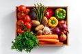 Fresh Vegetables in wooden box on white wooden background