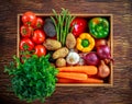 Fresh Vegetables in wooden box on wooden background Royalty Free Stock Photo
