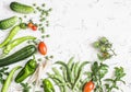 Fresh vegetables - zucchini, cucumbers, green peas and beans, parsnips, peppers, tomatoes, onions on a white background. Royalty Free Stock Photo