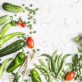 Fresh vegetables - zucchini, cucumbers, green peas and beans, parsnips, peppers, tomatoes, onions on a white background. Royalty Free Stock Photo