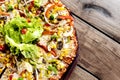 Fresh vegetarian pizza on wooden table background Royalty Free Stock Photo