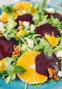 Fresh vegeterian salad with beetroot, orange and arugula