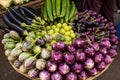 Fresh veggie basket from the Colaba Market farmer`s market: onions, aubergines, scallions, shallots, lady`s fingers Royalty Free Stock Photo