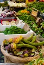 Fresh vernal artichokes with greens and vegetables on the market Campo dei Fiori, Rome Royalty Free Stock Photo