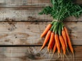 Fresh, vibrant carrots arranged on a rustic wooden table surface