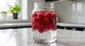 Raspberry Infusion: Fresh Raspberries Submerged in Glass Jar of Water, Simple and Refreshing Drink Royalty Free Stock Photo