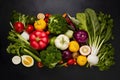 Fresh vibrant vegetables arranged on black backdrop, perfect for healthy dishes