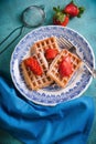 Fresh waffles with strawberries on table Royalty Free Stock Photo