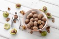 Fresh walnuts bowl on white wooden background Royalty Free Stock Photo