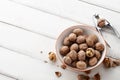 Fresh walnuts bowl on white wooden background Royalty Free Stock Photo