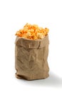 Fresh and warm tasty salt popcorn in a paper package