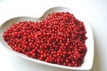 Fresh washed red currants berries in a heart shaped bowl Royalty Free Stock Photo