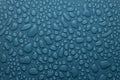 Fresh water drops on grey dim cold blue background as elegant pattern of different form drops, texture in modern elegant style. Royalty Free Stock Photo