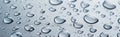 Fresh water drops on light blue surface, panoramic banner of rain droplets for background. Concept of wet, texture, splash, glass Royalty Free Stock Photo