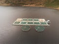 Fresh water fish farm in a lake. Aerial drone view