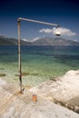 Fresh water shower harbour beach of Sami Cephalonia Kefelonia, Greece.