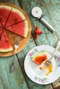 Fresh watermelon as vegan pizza with pizza knife and tire-bouchon on shabby wooden table Royalty Free Stock Photo