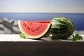 Fresh watermelon centerpiece on a white desk with ample free space