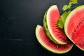 Fresh watermelon Fruits. Melon. On a black wooden background. Free space for text.