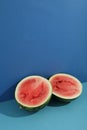 Fresh watermelon halves on two tone background Royalty Free Stock Photo