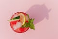 Fresh watermelon juice with mint and ice in the glass on pink background. Sweet summer dessert,cocktail healthy food concept, top Royalty Free Stock Photo