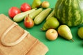 fresh watermelon, pears, apple and vegetables and cotton bag on green background, healthy food concept, green grocery shop, zero Royalty Free Stock Photo