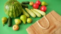 Fresh watermelon, pears, apple and vegetables and cotton bag on green background, healthy food concept, green grocery shop, zero Royalty Free Stock Photo