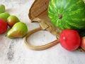 Fresh watermelon, pears, apple and vegetables on gray background, healthy food concept Royalty Free Stock Photo