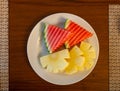 Fresh Watermelon and Pineapple slide in white dish Royalty Free Stock Photo