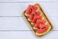 Fresh watermelon sliced on white wooden background - watermelon tropical fruit on wood tray , top view Royalty Free Stock Photo