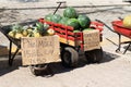 Fresh watermelons and pineapples at a rustic market stand, watermelons concept Royalty Free Stock Photo