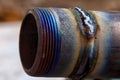 Fresh weld bead on a metal tube macro