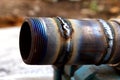 Fresh weld bead on a metal tube macro