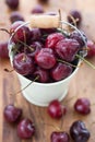 Fresh wet cherries in a white bucket Royalty Free Stock Photo