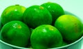 Fresh wet lemons (Citrus aurantiifolia) with water drops Royalty Free Stock Photo