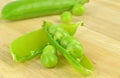 Fresh wet peas in a pea pod Royalty Free Stock Photo