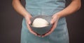 Fresh wheat dough, baker holds bowl with flour, bread or pizza, prepare ingredients for food, baking pastry