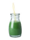 Fresh wheat grass juice and straw in glass bottle on white Royalty Free Stock Photo