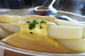 Fresh white asparagus from Beelitz , which is still steaming, on a plate with sauce hollandaise and asparagus tongs Royalty Free Stock Photo